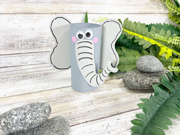 DIY toilet paper roll elephant craft with paper ears and googly eyes for safari party crafts and activities