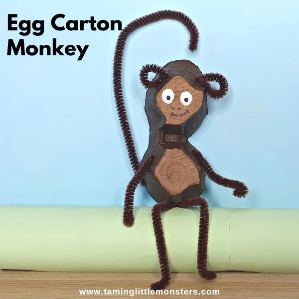 Egg carton monkey craft with pipe cleaner arms, legs, and tail for safari party crafts and activities