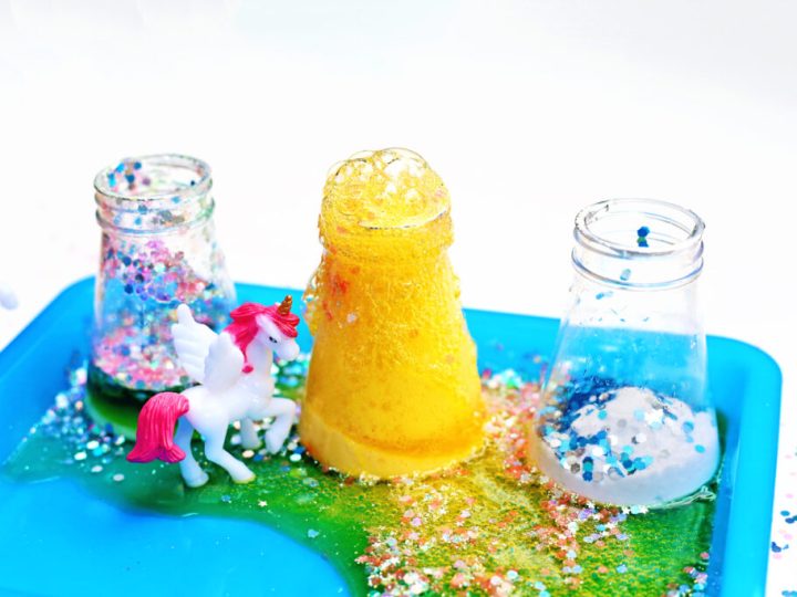 A fizzy unicorn potion science activity with bubbling jars glitter and mini unicorn figurines is one of the most exciting unicorn party crafts and activities
