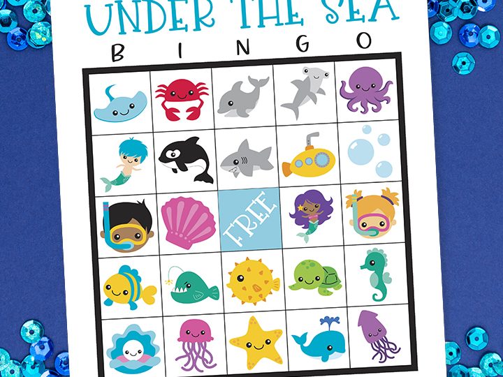 A colorful printable under the sea party bingo card with cute ocean animal illustrations on a blue sequin background