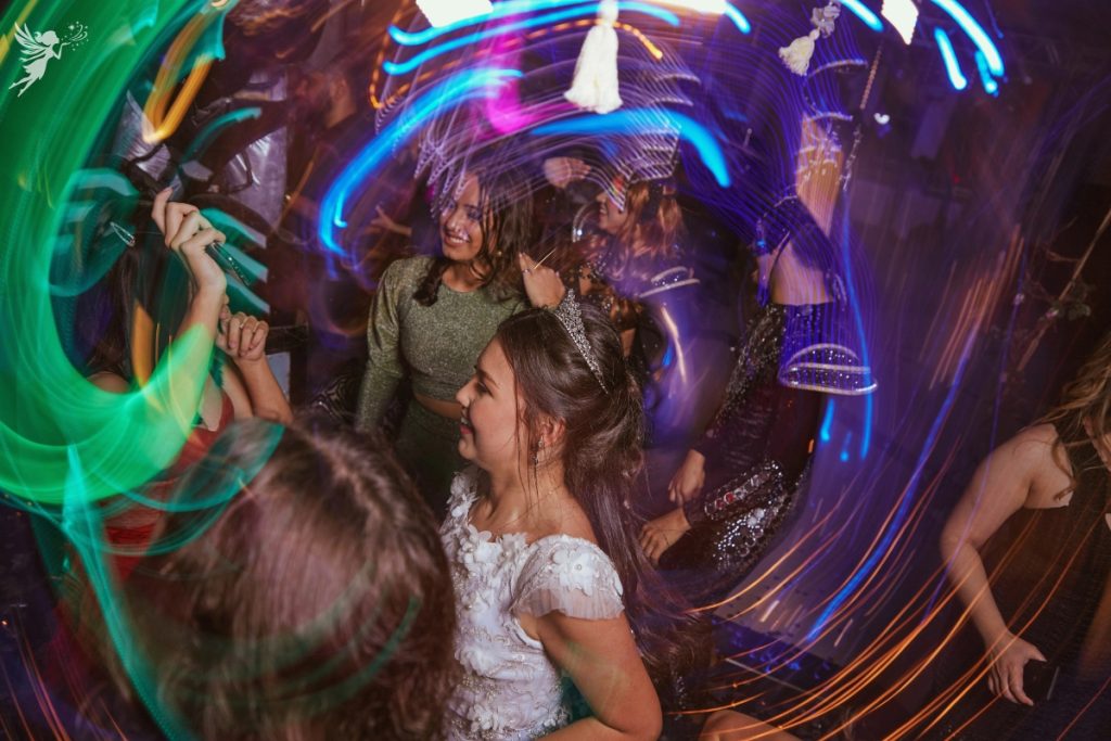 teens dancing with outdoor neon glow