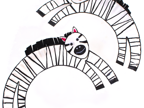 Paper plate jumping zebra craft with black and white stripes for safari party crafts and activities
