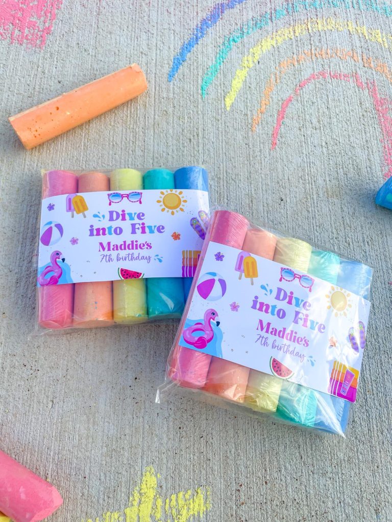 Two packs of pastel sidewalk chalk with custom "Dive into Five" birthday labels featuring flamingo and summer icons, creative kids pool party favors.
