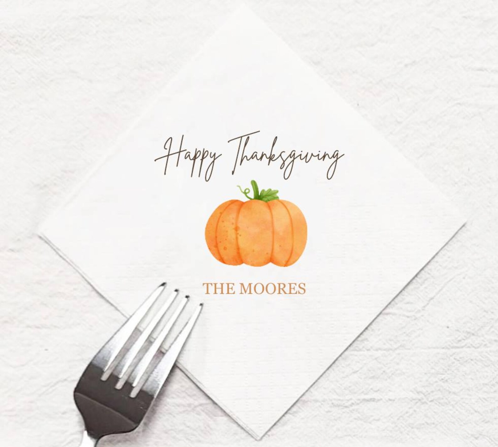 Custom Thanksgiving napkin with watercolor pumpkin, "Happy Thanksgiving" script, and personalized family name—a thoughtful Thanksgiving hostess gift idea.