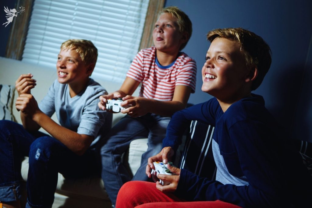 gamers party for tweens - boys with game controllers having fun