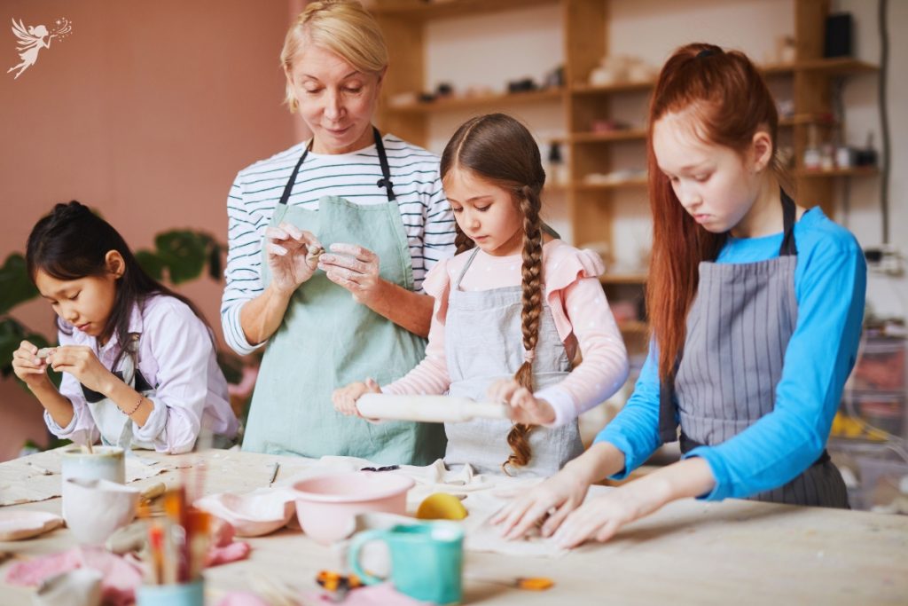 class of girls cooking cooking with a teacher