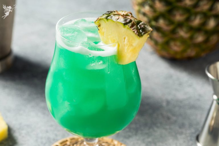 Close up of a blue hawaiian tropical mocktail drink with pineapple slice