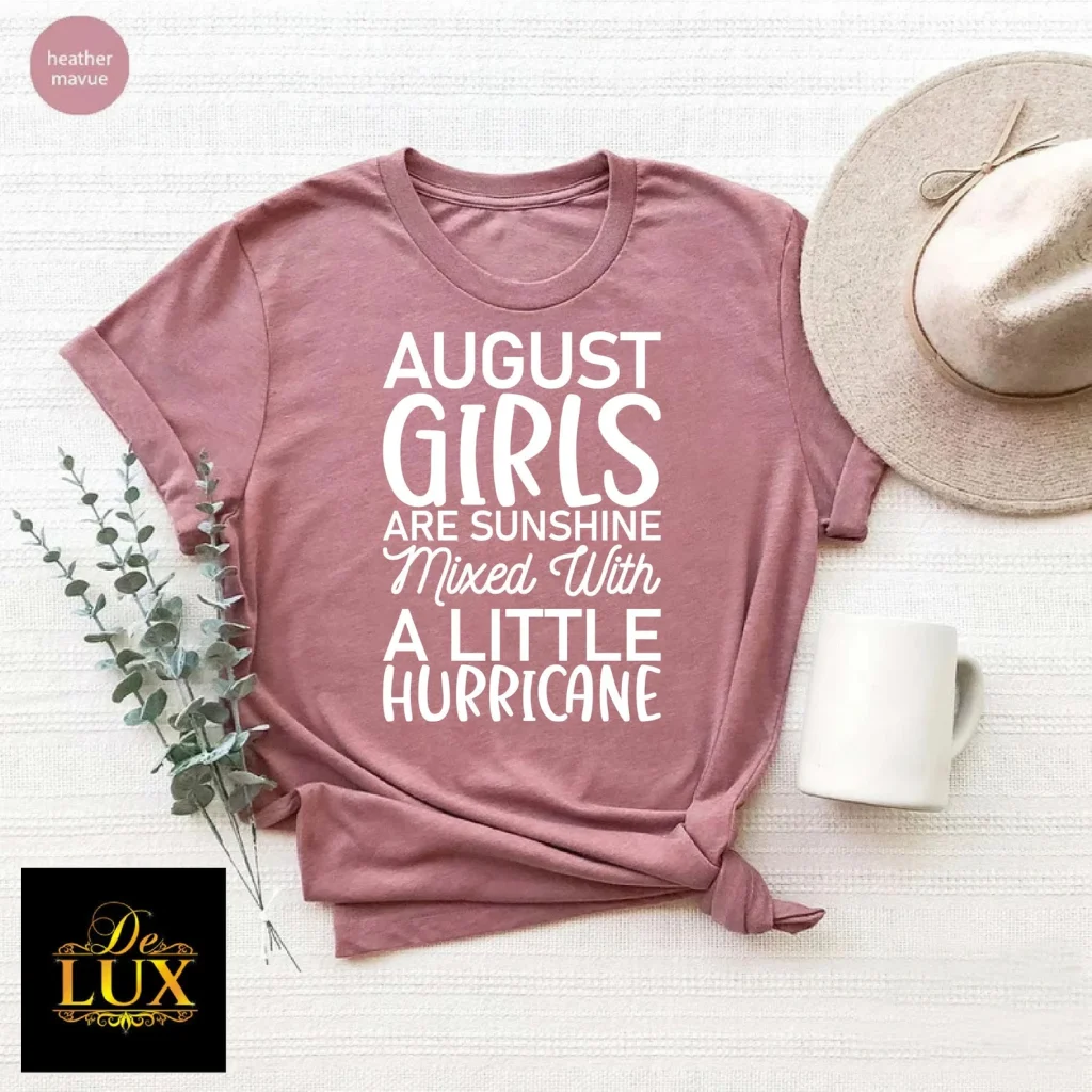 A mauve cotton tee with a bold white humor quote about August girls, a fun and relatable August birthday gift idea.