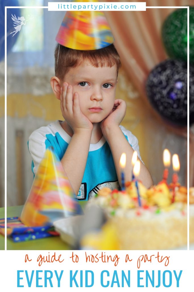 a shy child at a birthday party with his cake
