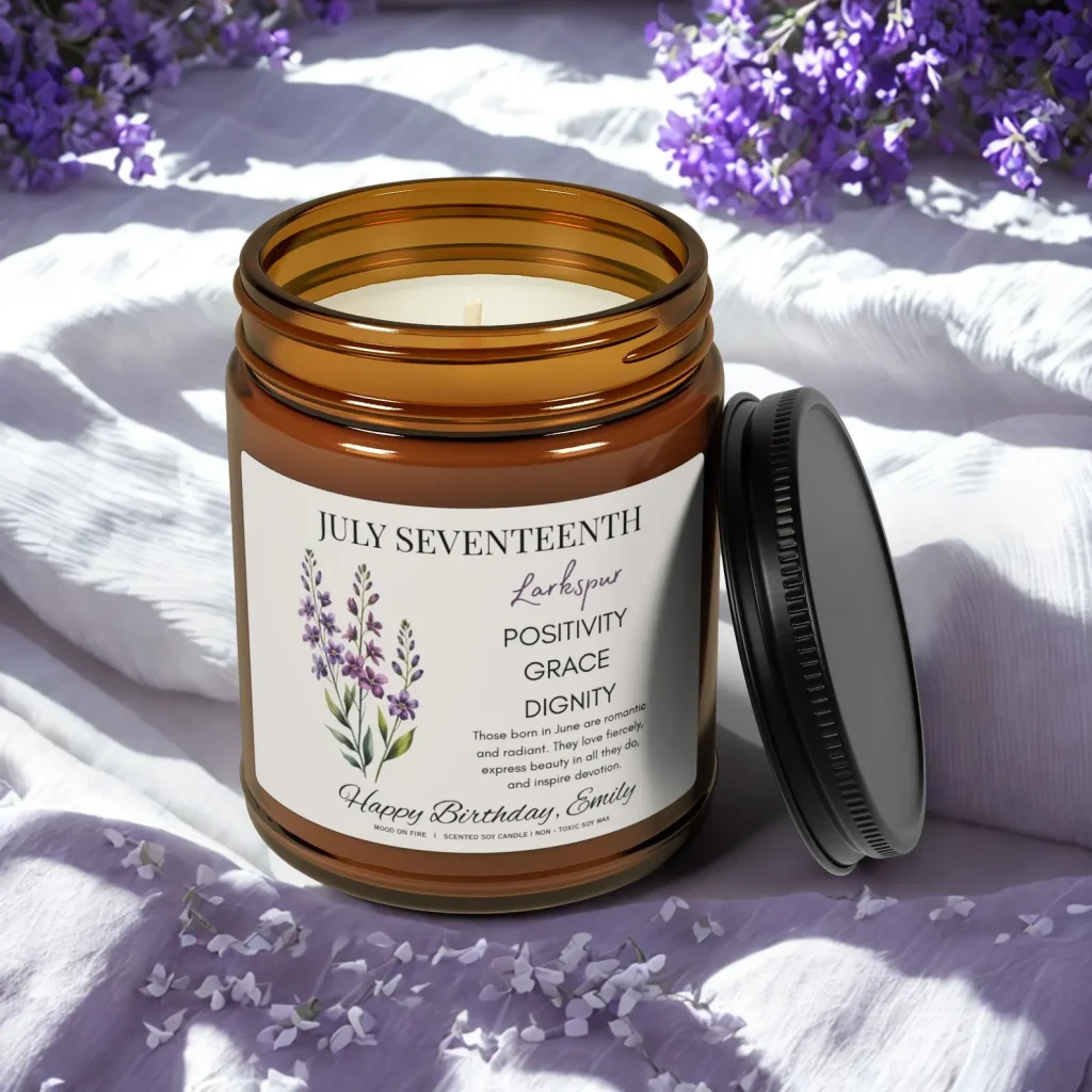 A personalized amber jar soy candle with a larkspur birth flower label and a custom birthday name, a thoughtful and aromatic July birthday gift idea.