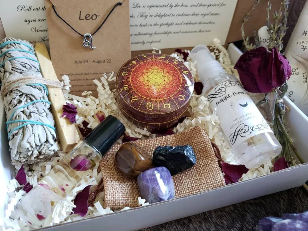 Leo zodiac gift box filled with tumbled crystals, sage bundle, palo santo, moon mist spray, zodiac tin and a dried rose, a luxurious July birthday gift idea.