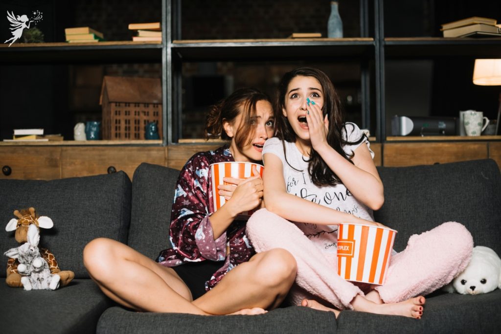 teen girls watching a scary movie halloween fall themed birthday party