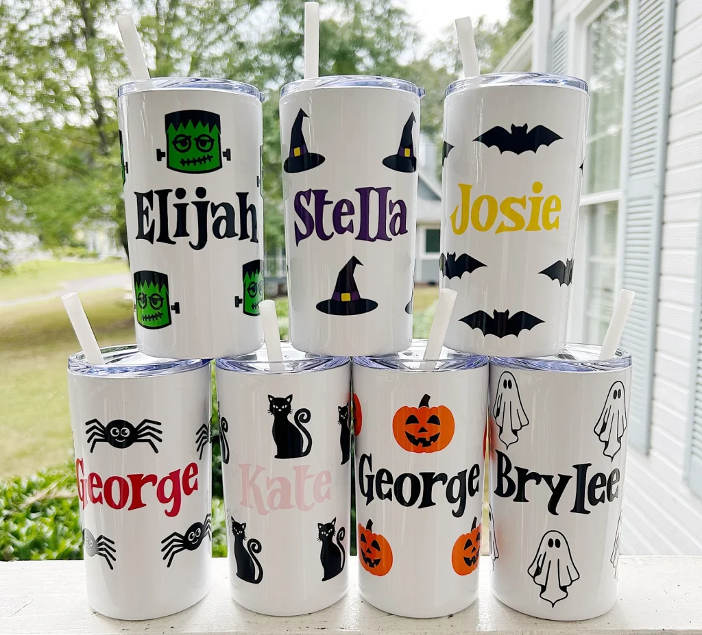 Personalized Halloween tumblers with names and spooky designs like ghosts, bats, and pumpkins, festive Halloween party favors for kids.