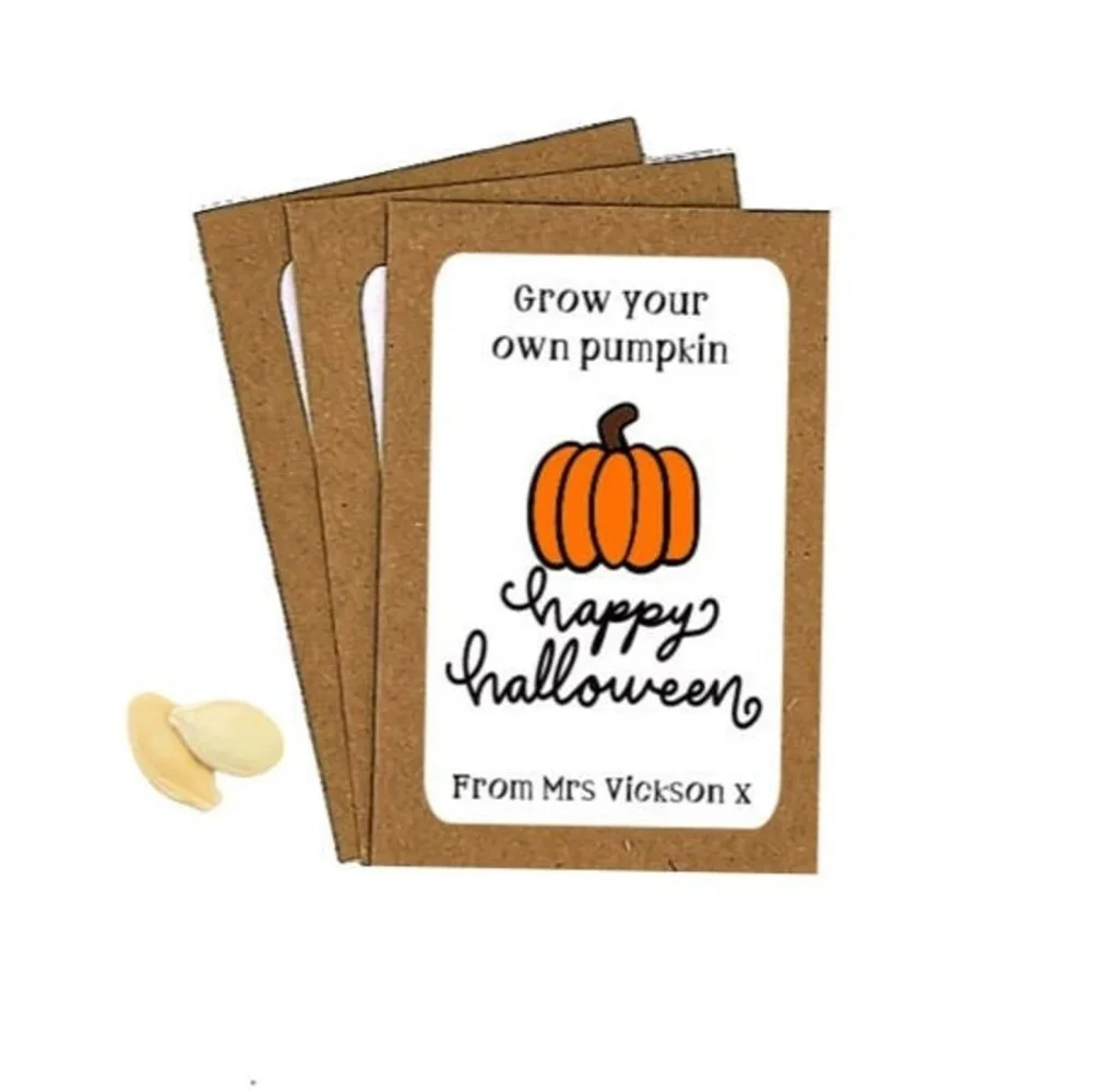 Grow-your-own pumpkin seed packets with a Happy Halloween design, a fun and unique choice for Halloween party favors.