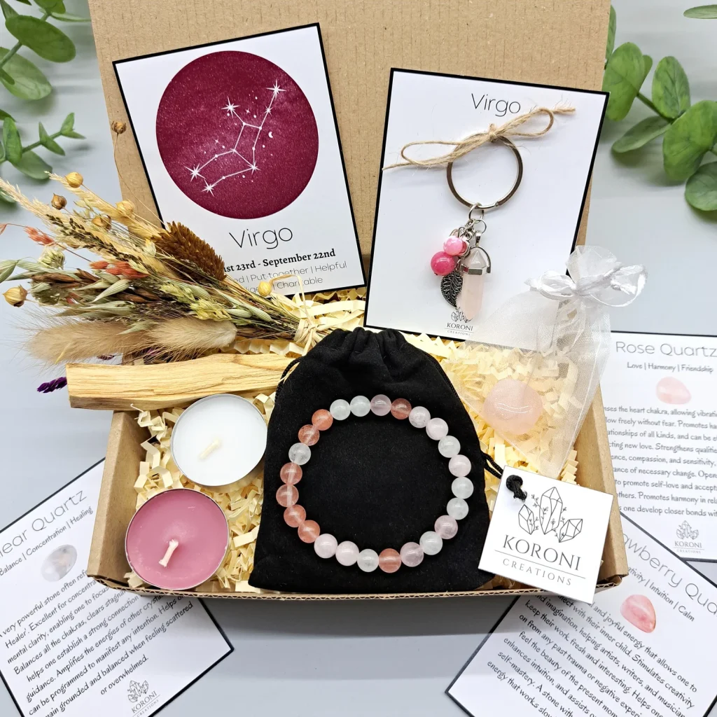 Virgo zodiac crystal gift box containing a rose quartz and strawberry quartz beaded bracelet, constellation keychain, candles, palo santo and dried flowers, a lovely August birthday gift idea.