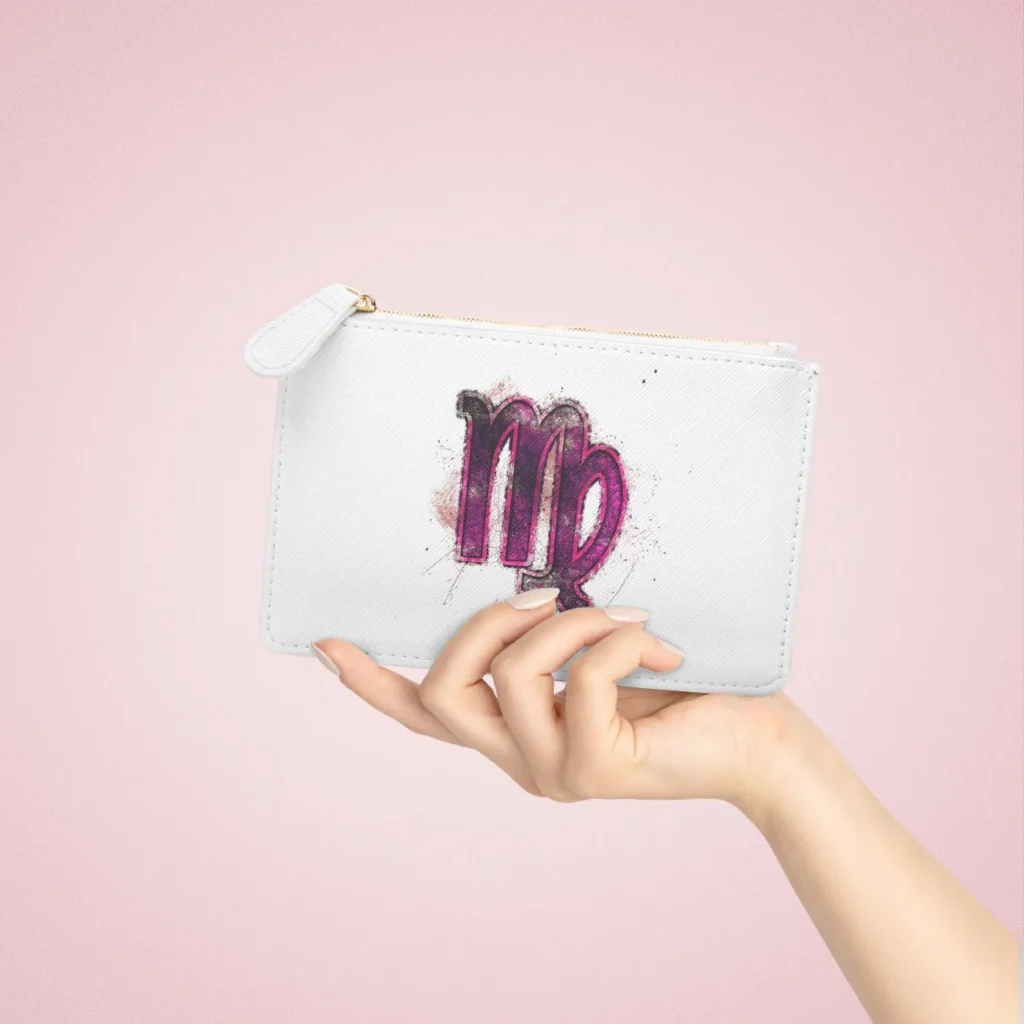 A white vegan leather mini clutch bag printed with a bold pink watercolour Virgo zodiac symbol, a chic and practical August birthday gift idea.