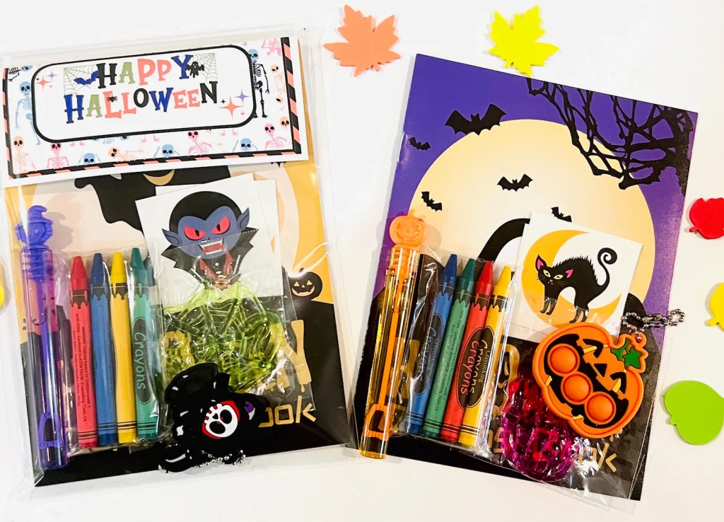 Halloween goodie bags for kids with crayons, coloring books, stickers, and keychains, colorful and fun Halloween party favors.