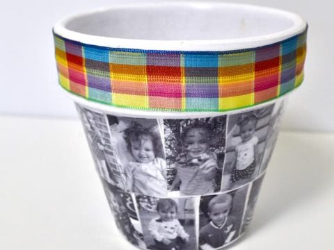 A decorative planter wrapped with childhood photos and colorful ribbon, a creative homemade gift for grandparents.