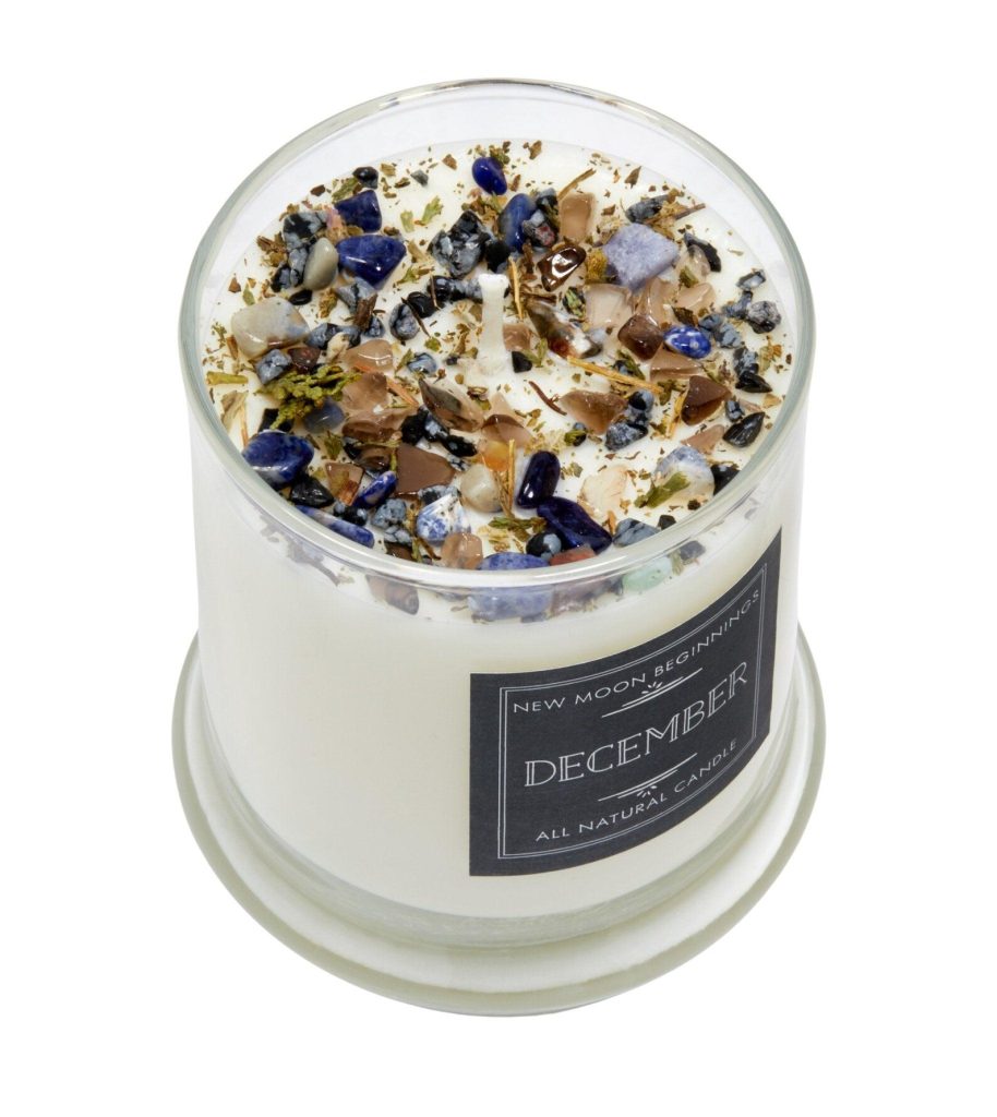 A natural soy December birthstone candle topped with sodalite, lapis and mixed crystal chips, a special December birthday gift idea.