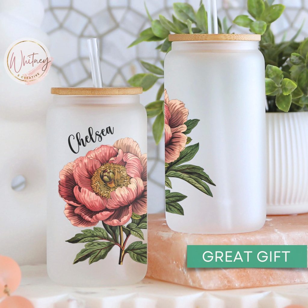Two personalized frosted glass tumblers with bamboo lids featuring a vintage pink peony botanical print, gorgeous and practical November birthday gift ideas.