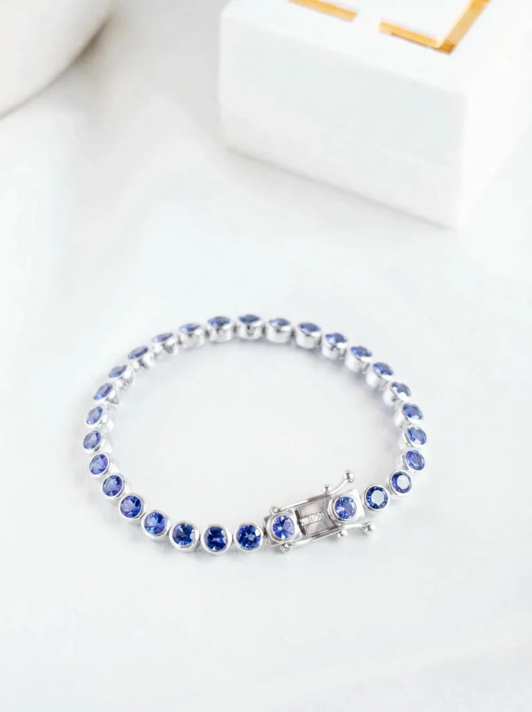 An elegant tanzanite tennis bracelet in silver with round blue gemstones, a stunning December birthday gift idea.