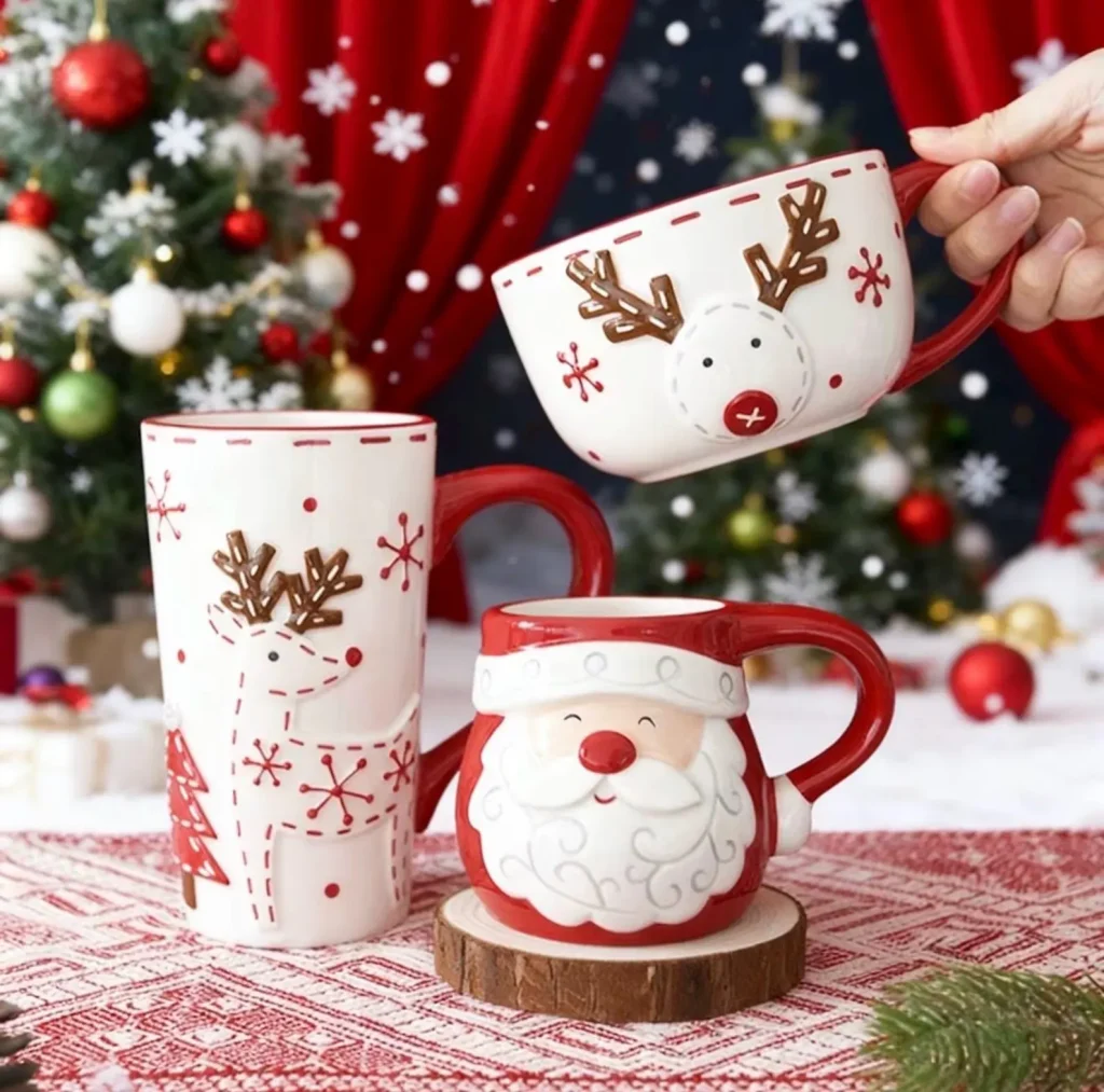 Three piece ceramic mug set featuring Santa and reindeer designs in red and white, playful neighbor Christmas gift ideas for the holiday season.