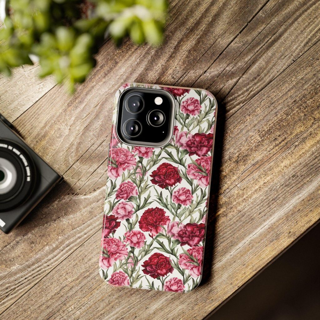A pink and red carnation birth flower phone case with a botanical pattern, a pretty and practical January birthday gift idea.