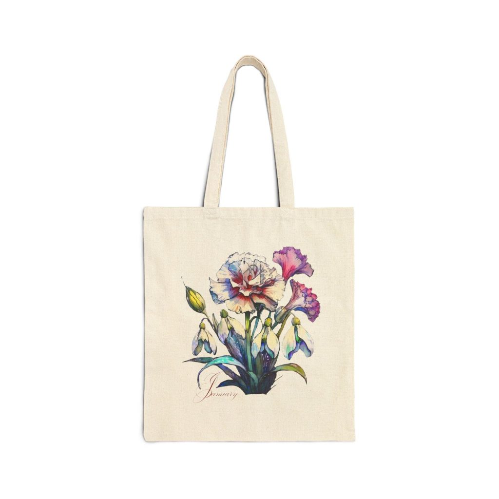 A natural canvas tote bag printed with watercolor carnations and snowdrops with a January script, a charming January birthday gift idea.