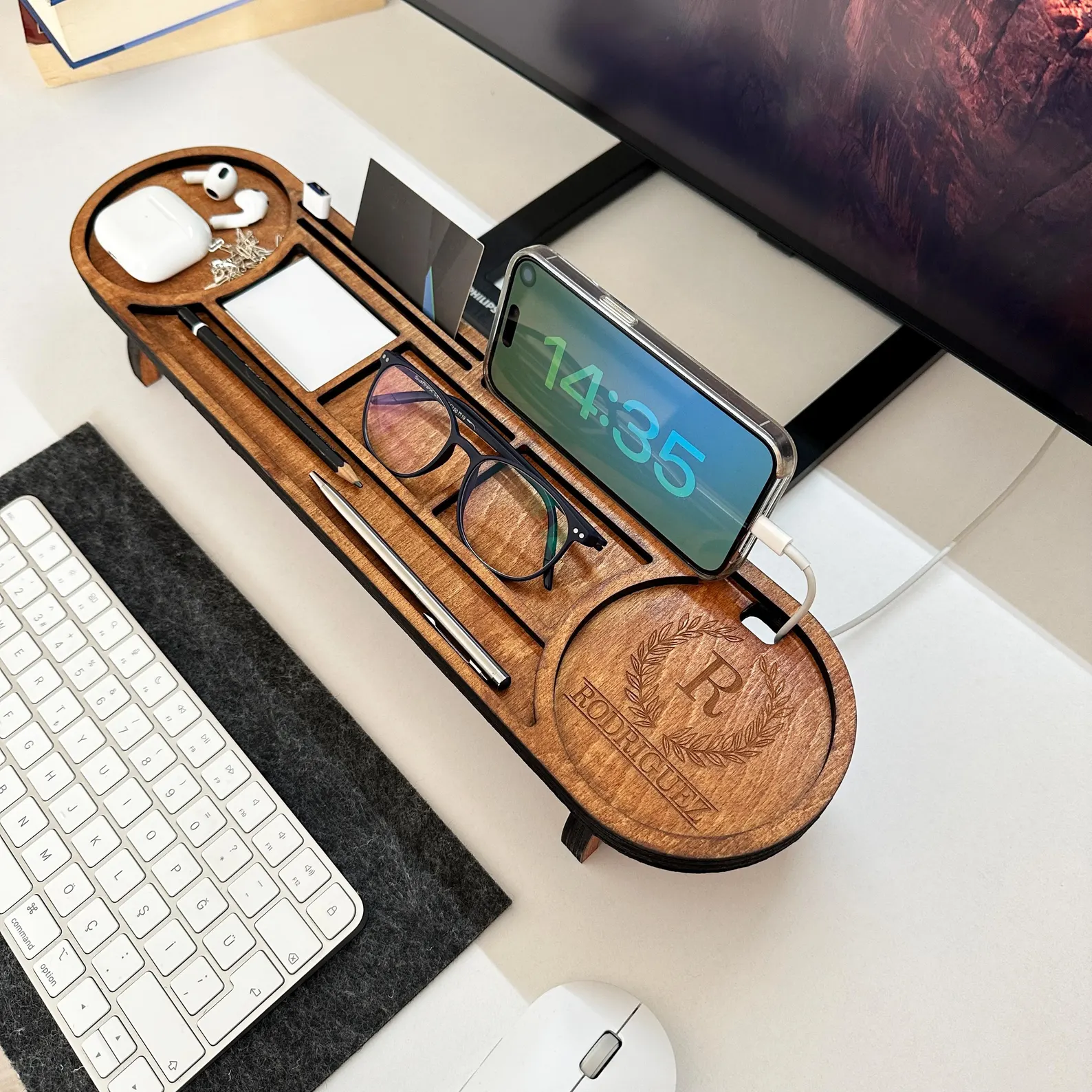 Personalized engraved wood desk organizer holding phone, glasses, pencils and earbuds, a practical and stylish Christmas gift ideas for coworkers.