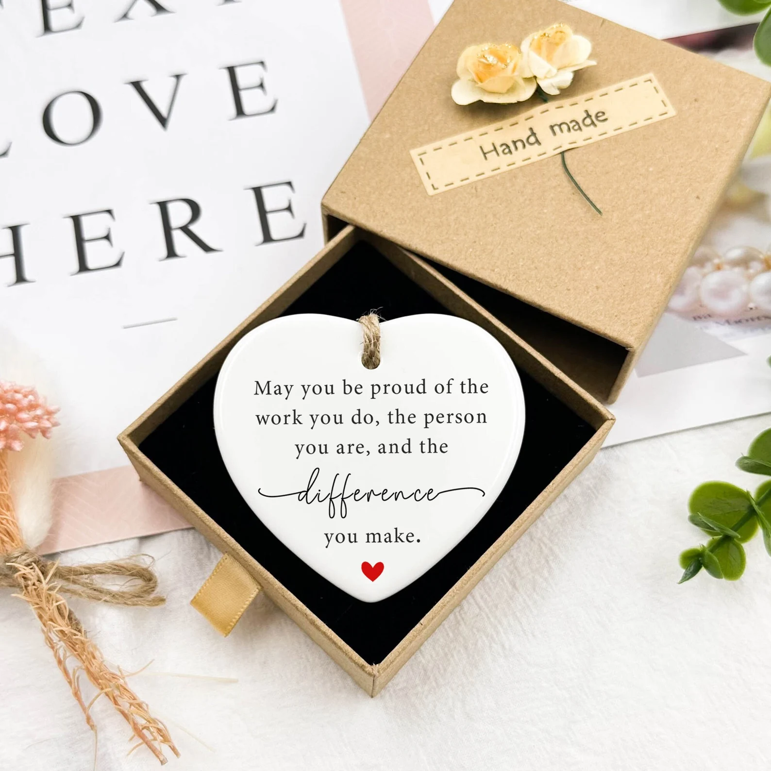 Handmade ceramic heart ornament with proud worker appreciation message in kraft gift box, among the most meaningful Christmas gift ideas for coworkers.